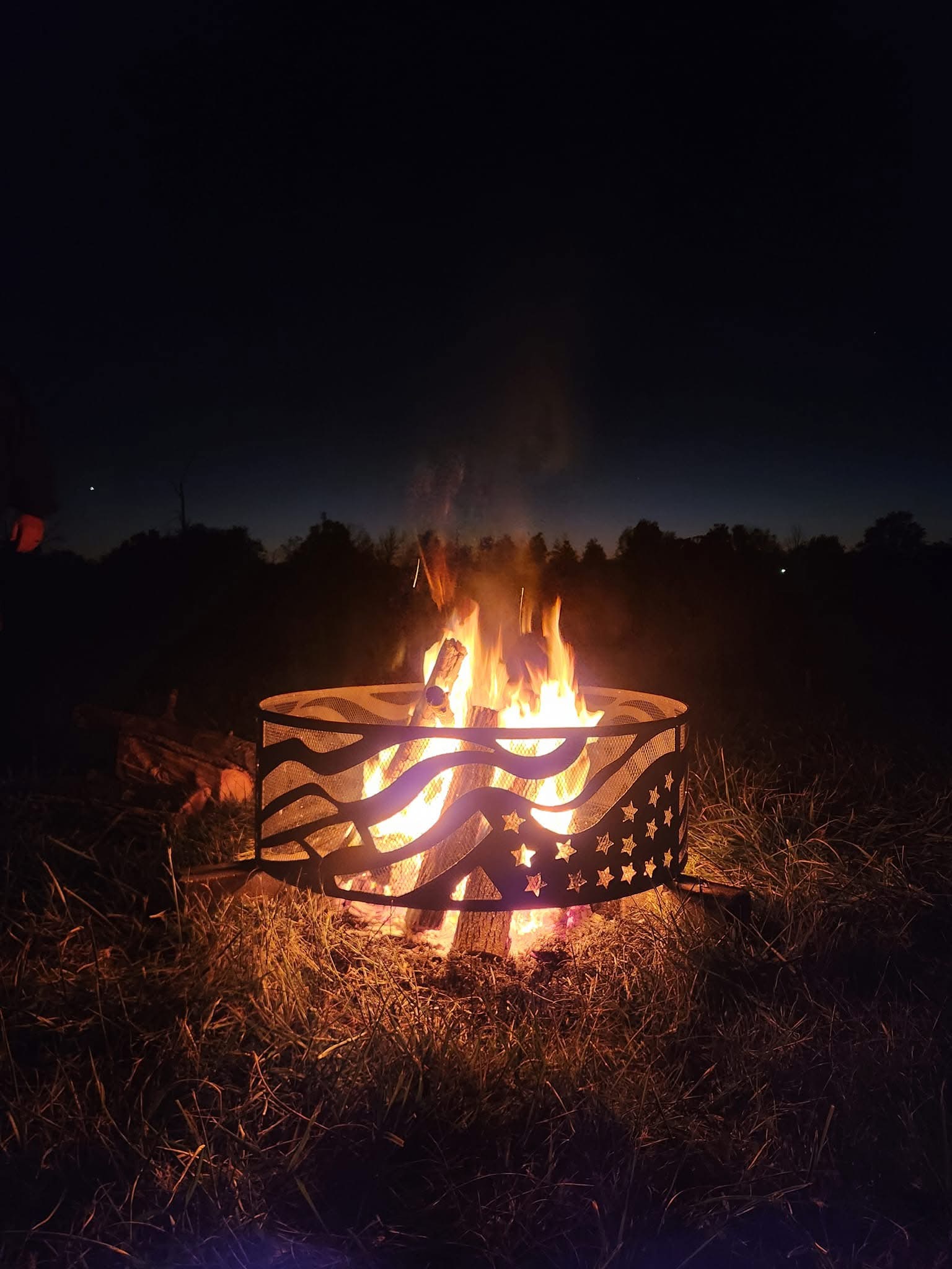American flag firepit on a dark night